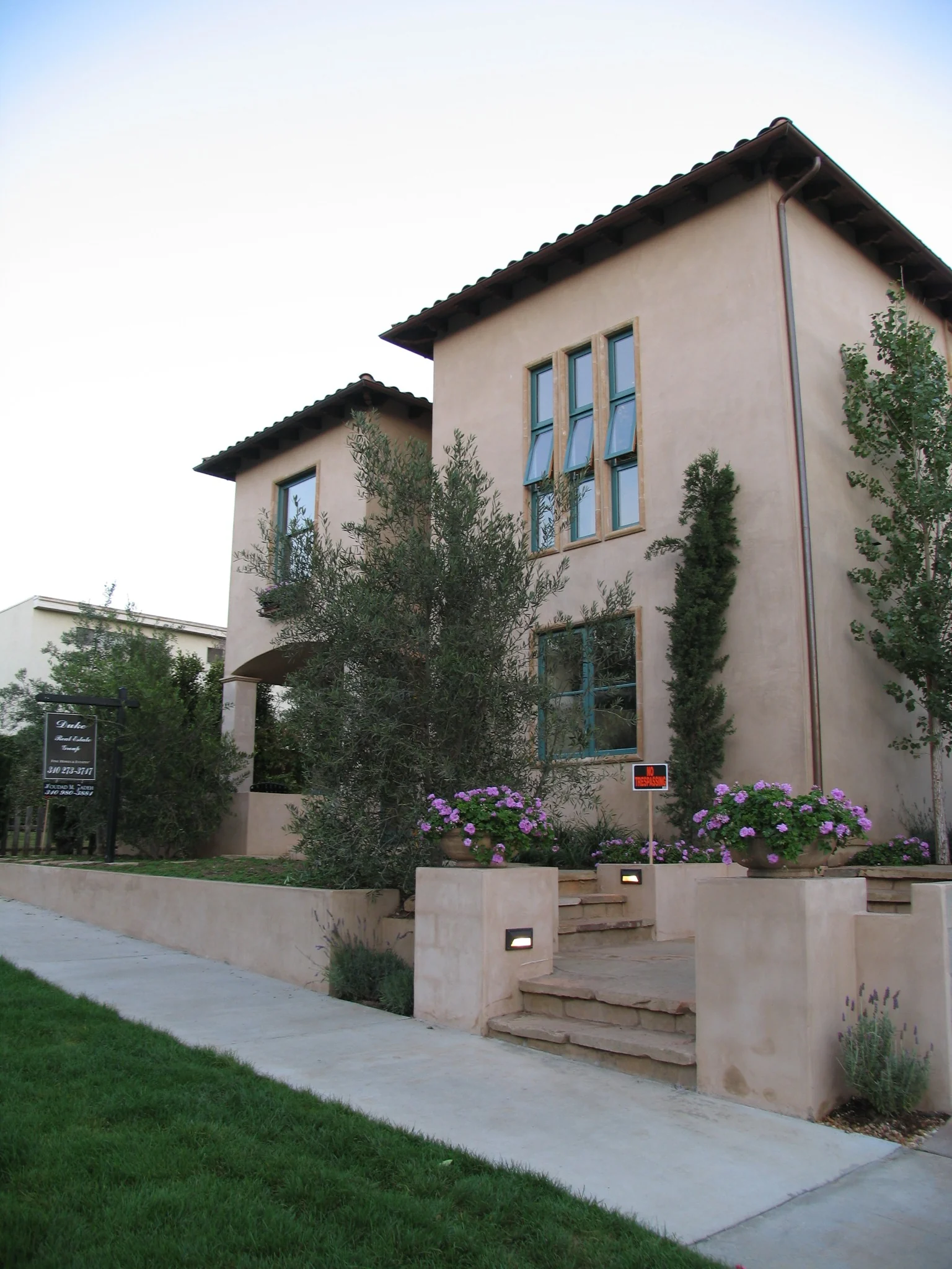 Angled street view of the two completed condominiums