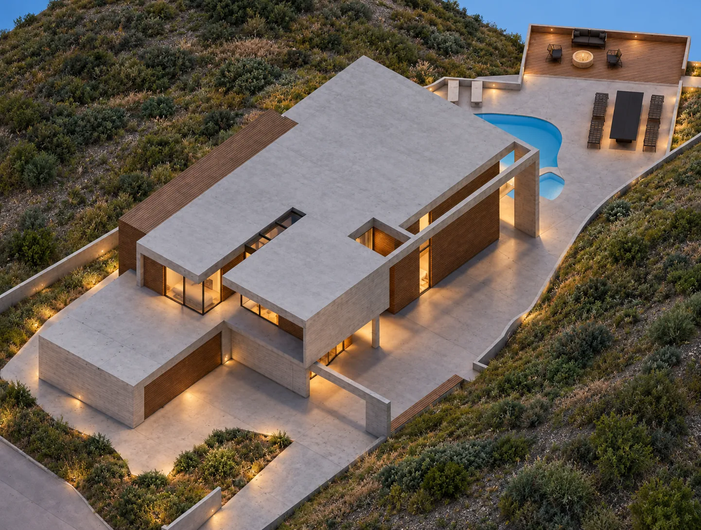 Aerial view showing roof geometry, arrival court, pool and landscape deck