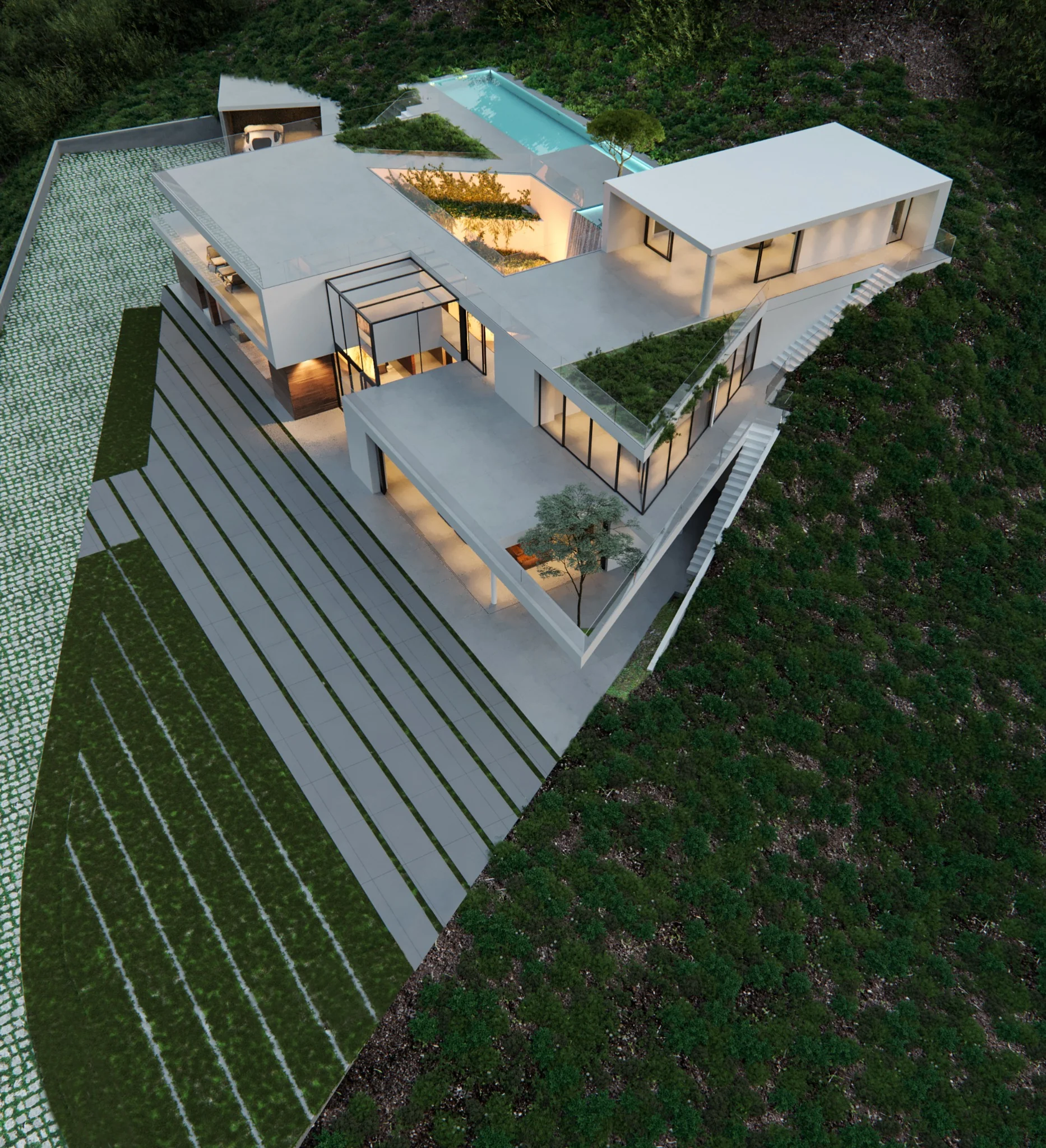 Aerial view showing the residence fitted within the existing hillside landscape