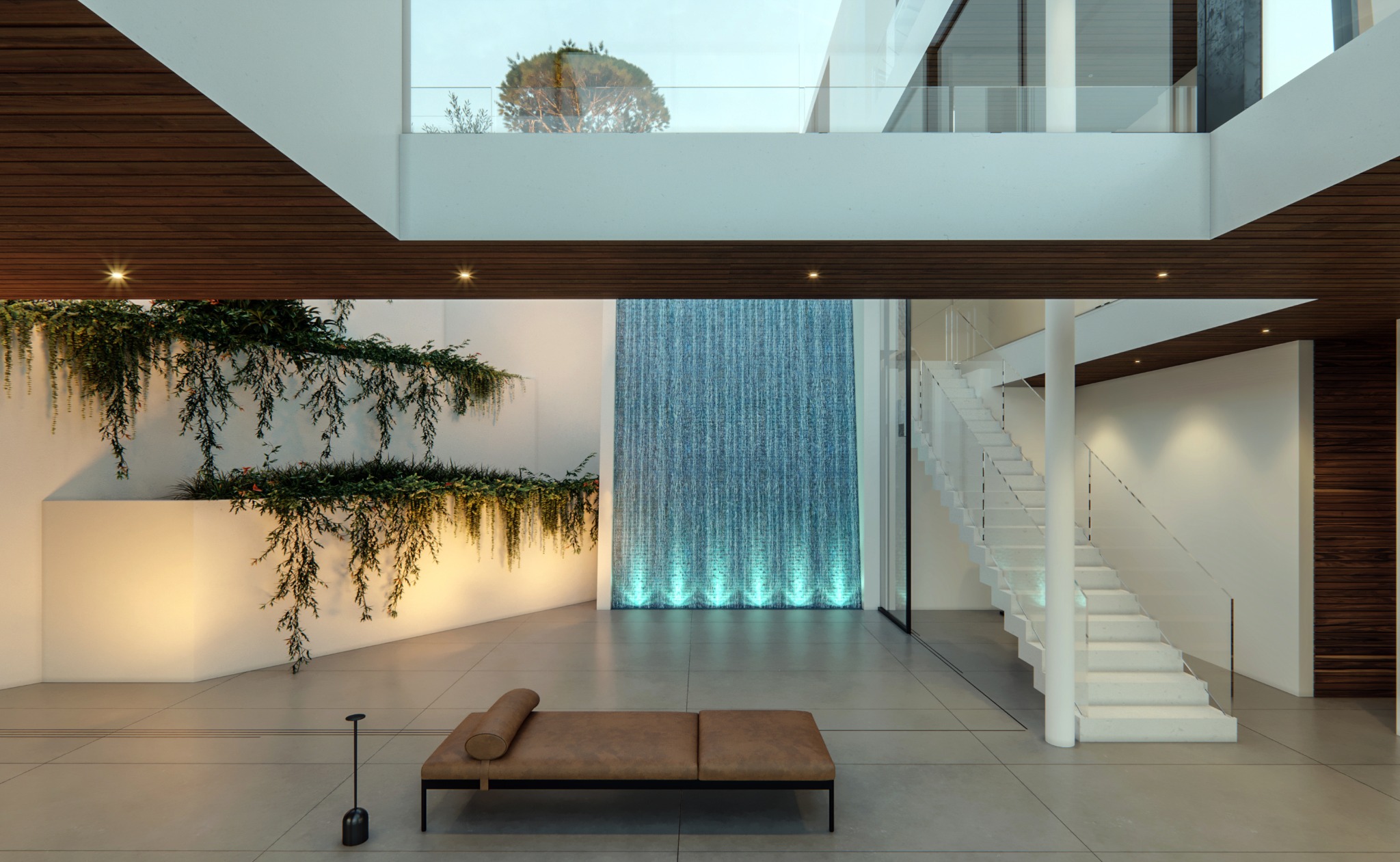 The waterfall and planting at the center of the residence