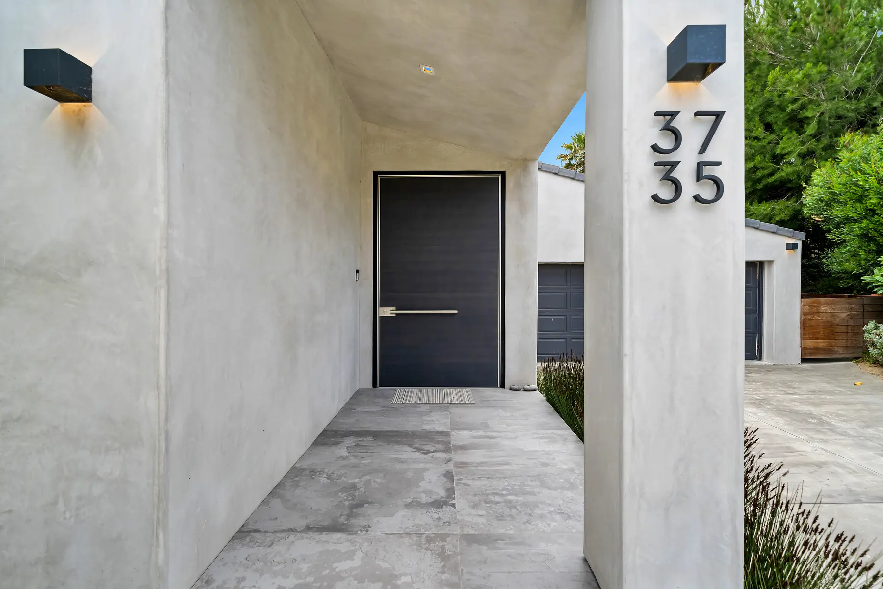 Minimal concrete entry at 3736 Malibu Country Drive