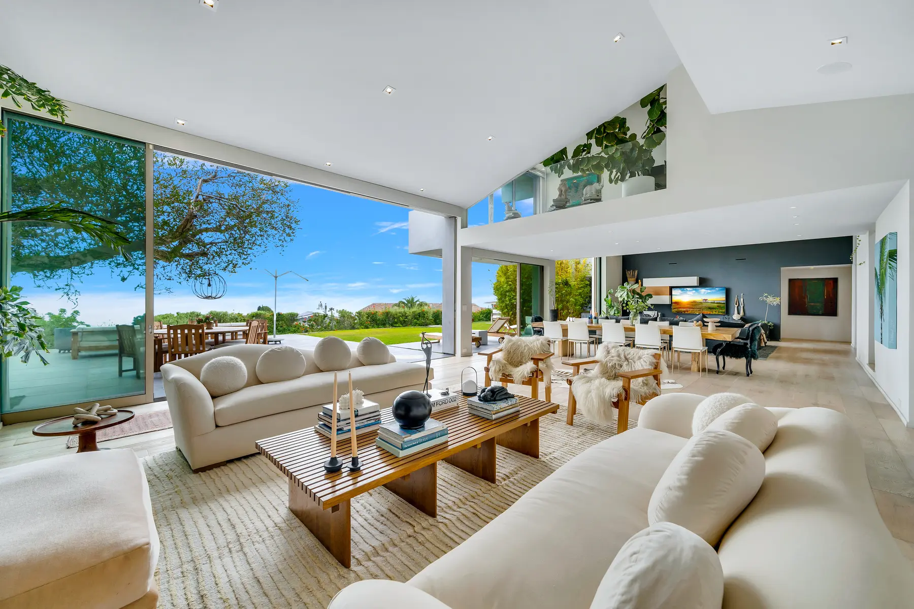 3736 Malibu Country Drive living room opening continuously to the garden and terrace