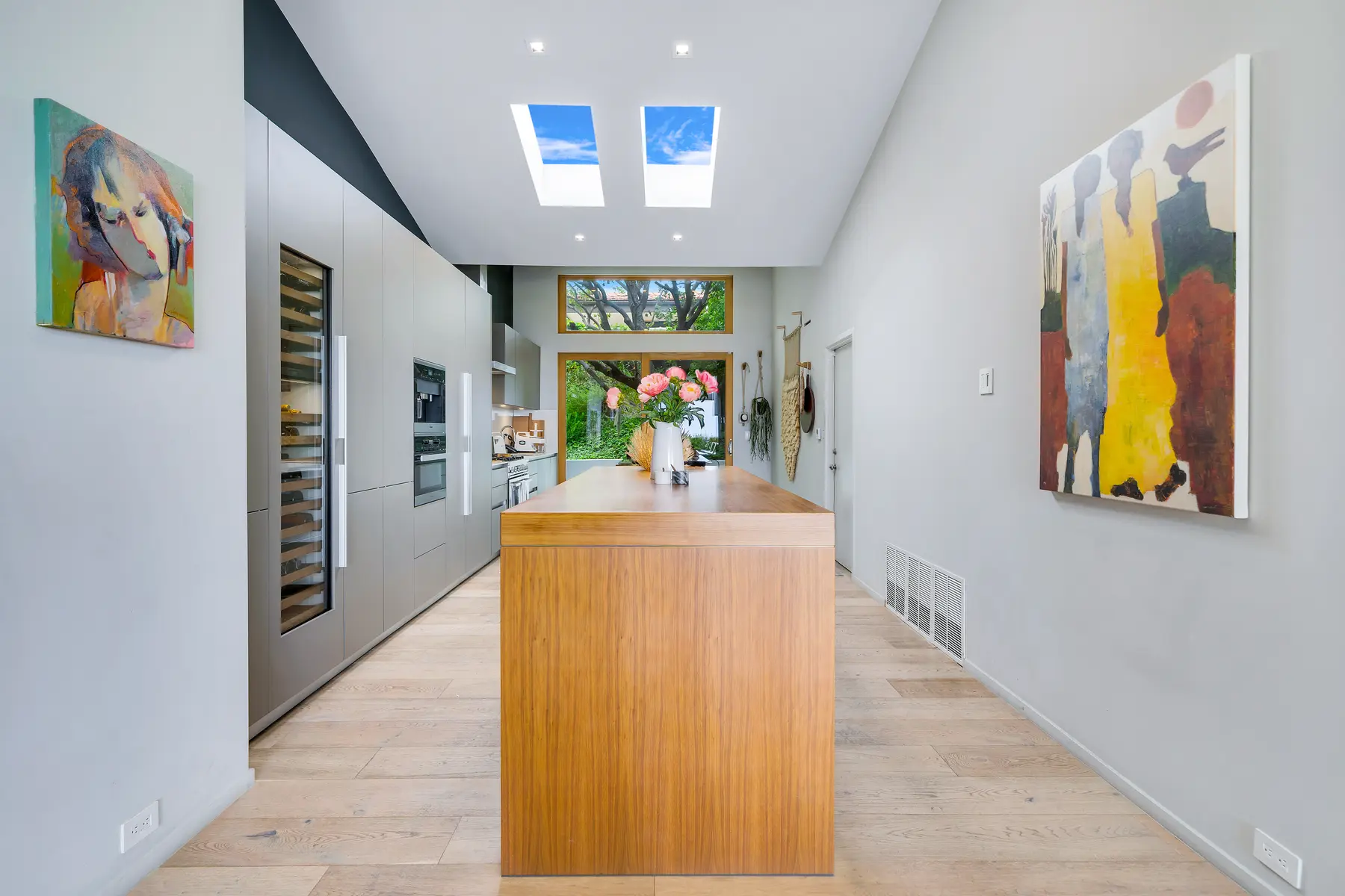 Skylit passage connecting the remodeled house