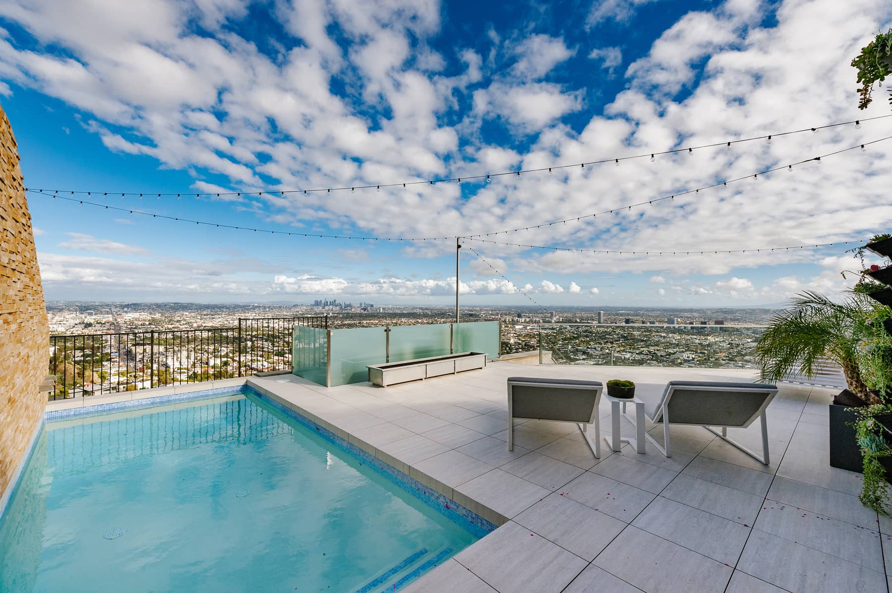 Pool terrace and panoramic daytime view from 8693 Franklin