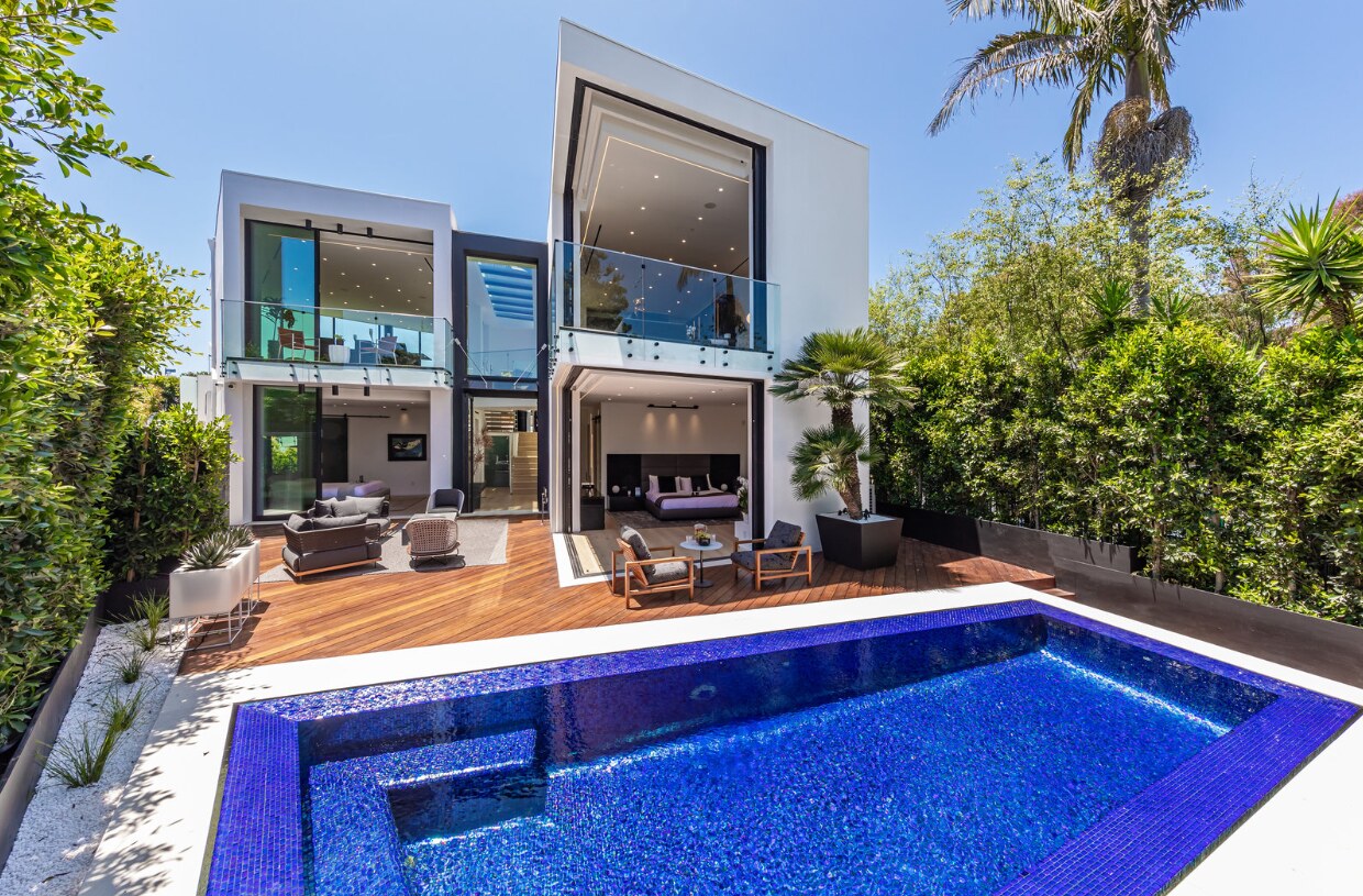 Pool garden with living and bedroom spaces open to the deck