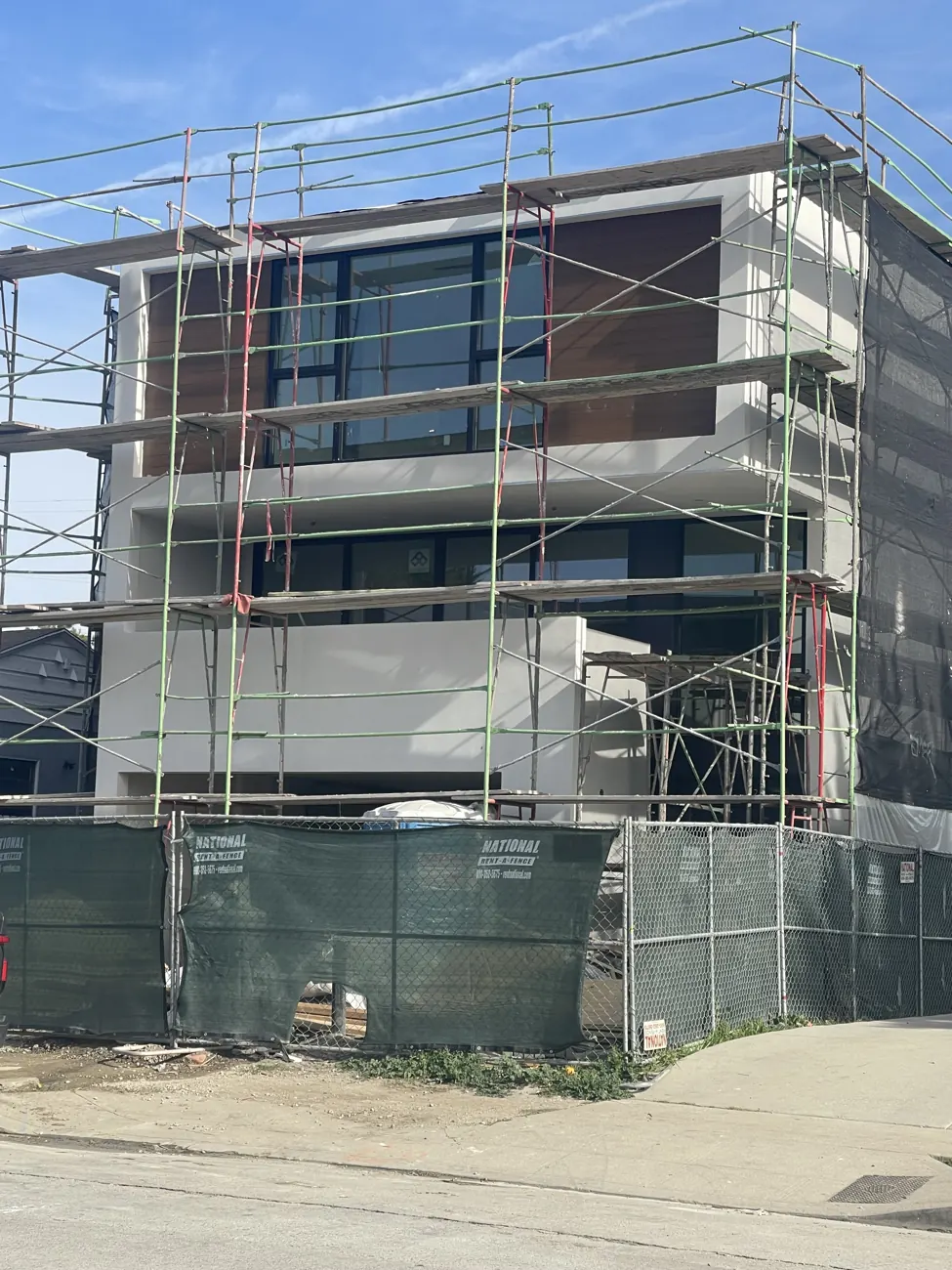 Condominium street elevation with scaffolding during construction