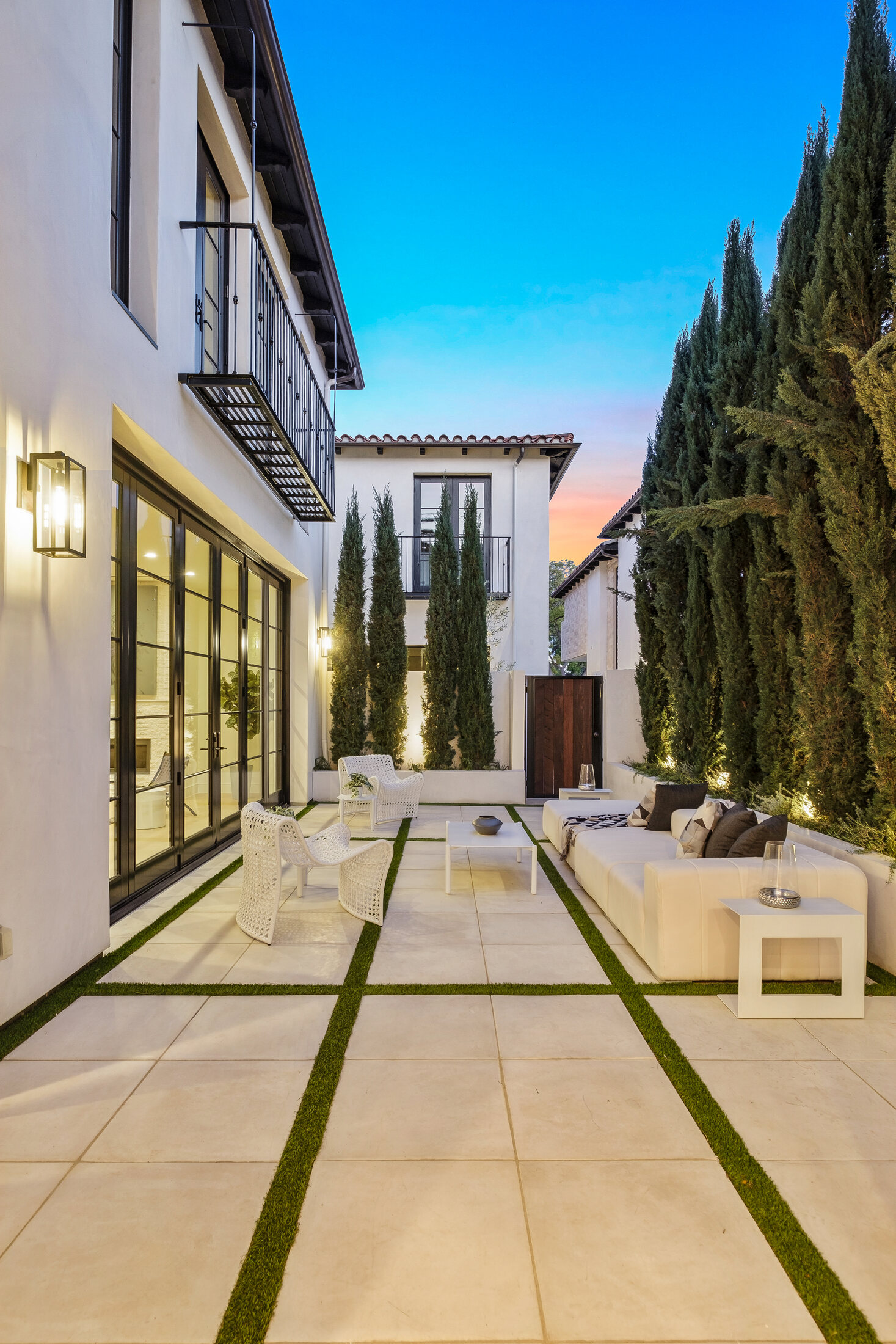 Linear courtyard with cypress planting and outdoor seating