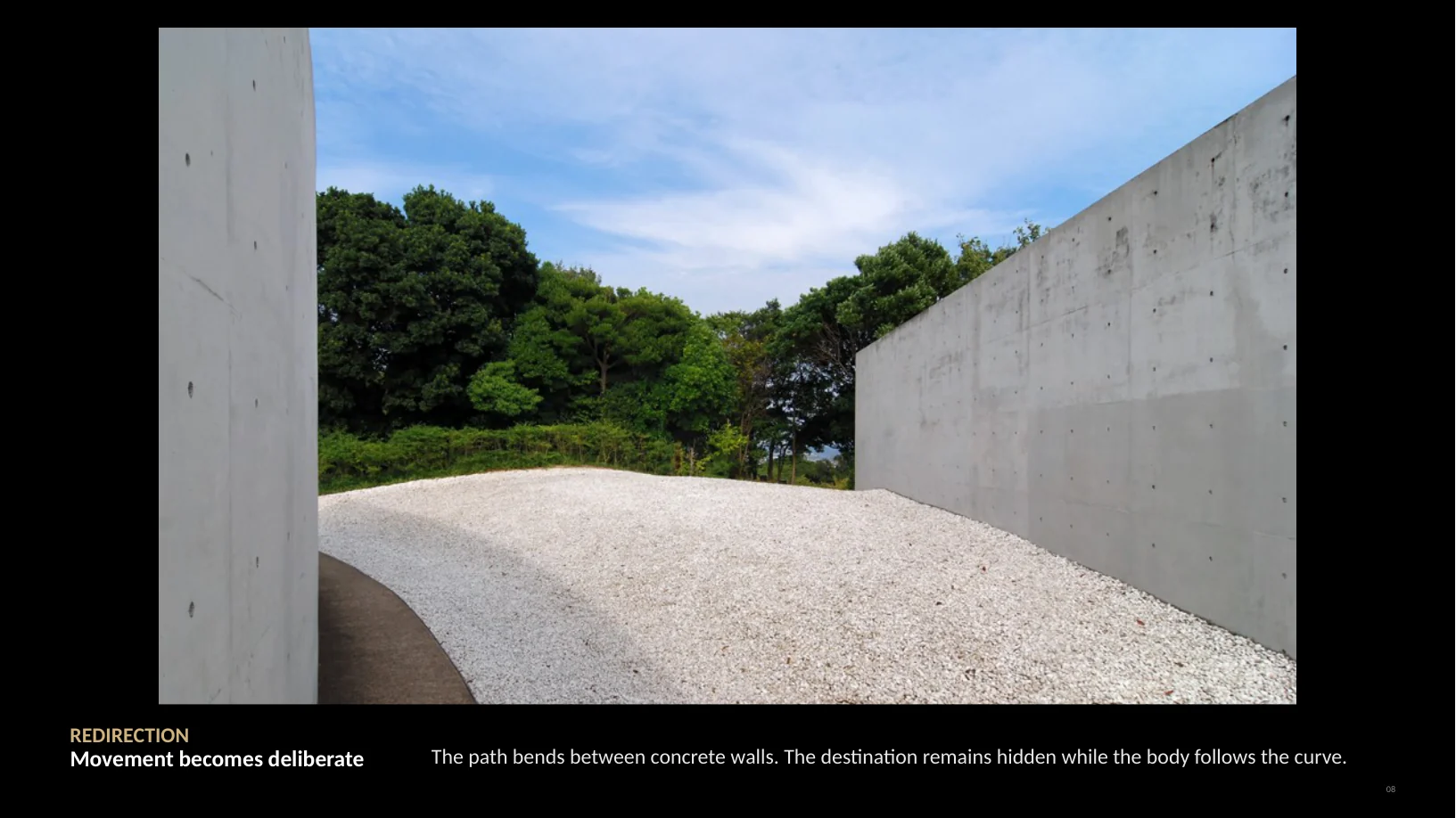 Slide 8 of 22: REDIRECTION Movement becomes deliberate The path bends between concrete walls. The destination remains hidden while the body follows the curve. 08