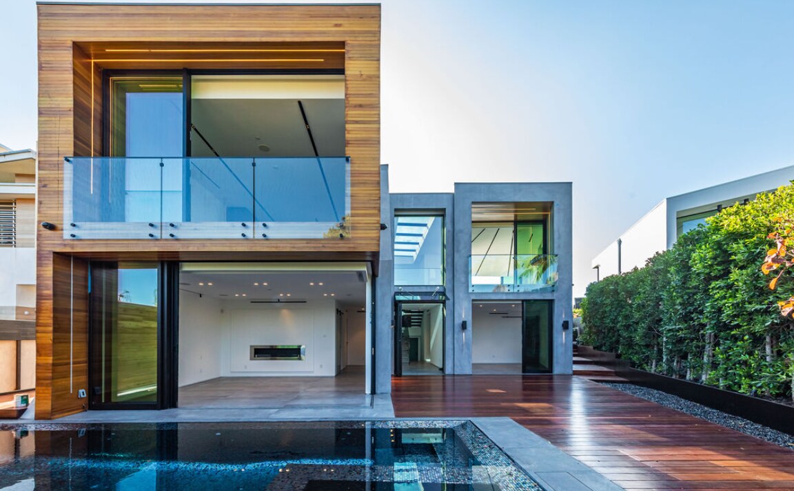 Pool court framed by wood, glass and concrete