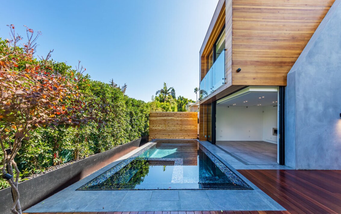 Long reflecting pool beside the open living area