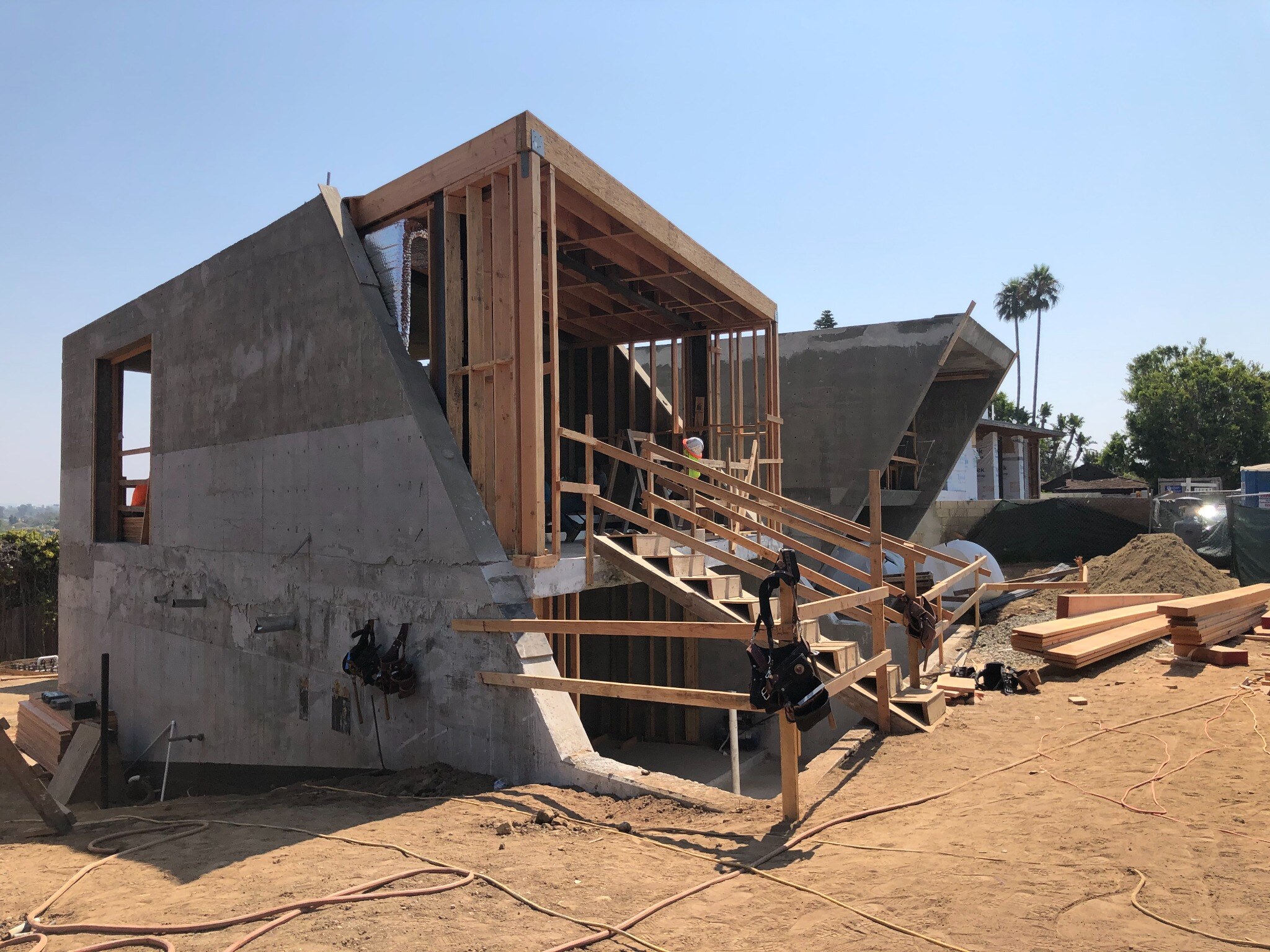 Tramonto residence during construction showing concrete walls, sloped forms and wood framing